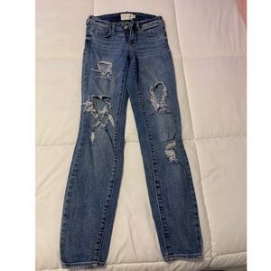 Distressed denim jeans